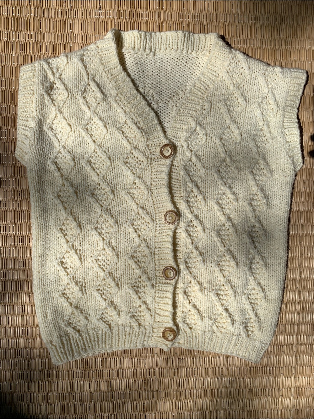 Vintage hand-knit wool button sweater vest in cream